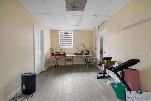 a livingroom with workspace and a window