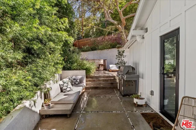 a view of a backyard with chairs