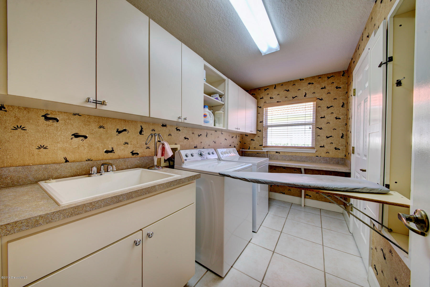 4230 Stoney Point Road, Unit SUNTREE Melbourne, FL 32940 - Photo 35 of 40 Built-in Ironing Board