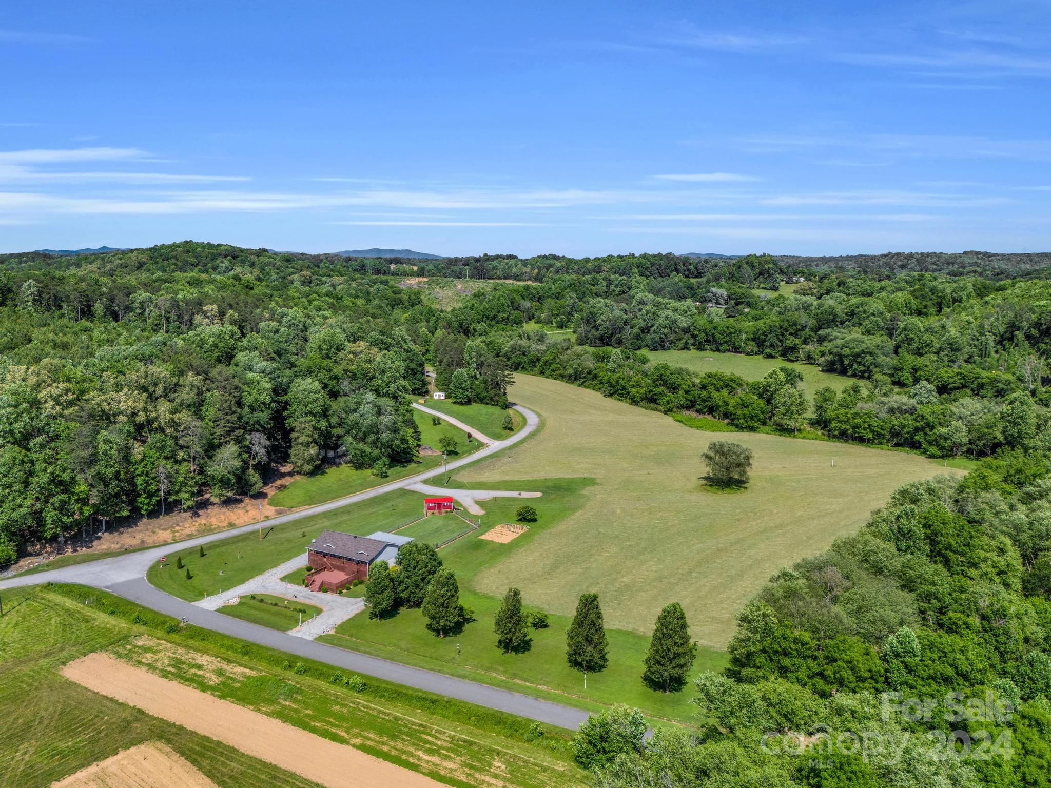 202 Mogene Road Rutherfordton, NC 28139 - Photo 11 of 40 a view of a tennis ground with a swimming pool