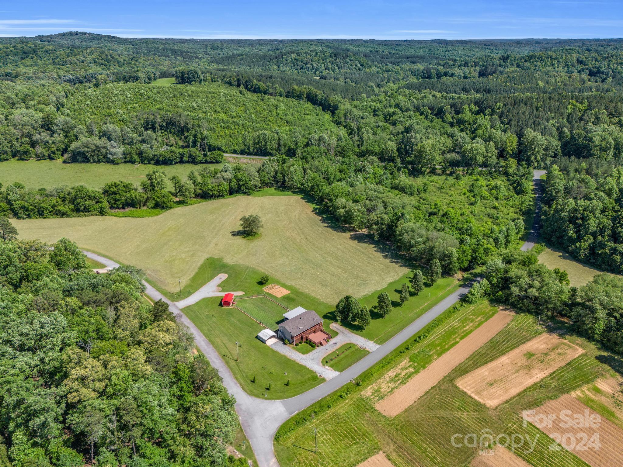 202 Mogene Road Rutherfordton, NC 28139 - Photo 15 of 40 an aerial view of a golf course with chairs