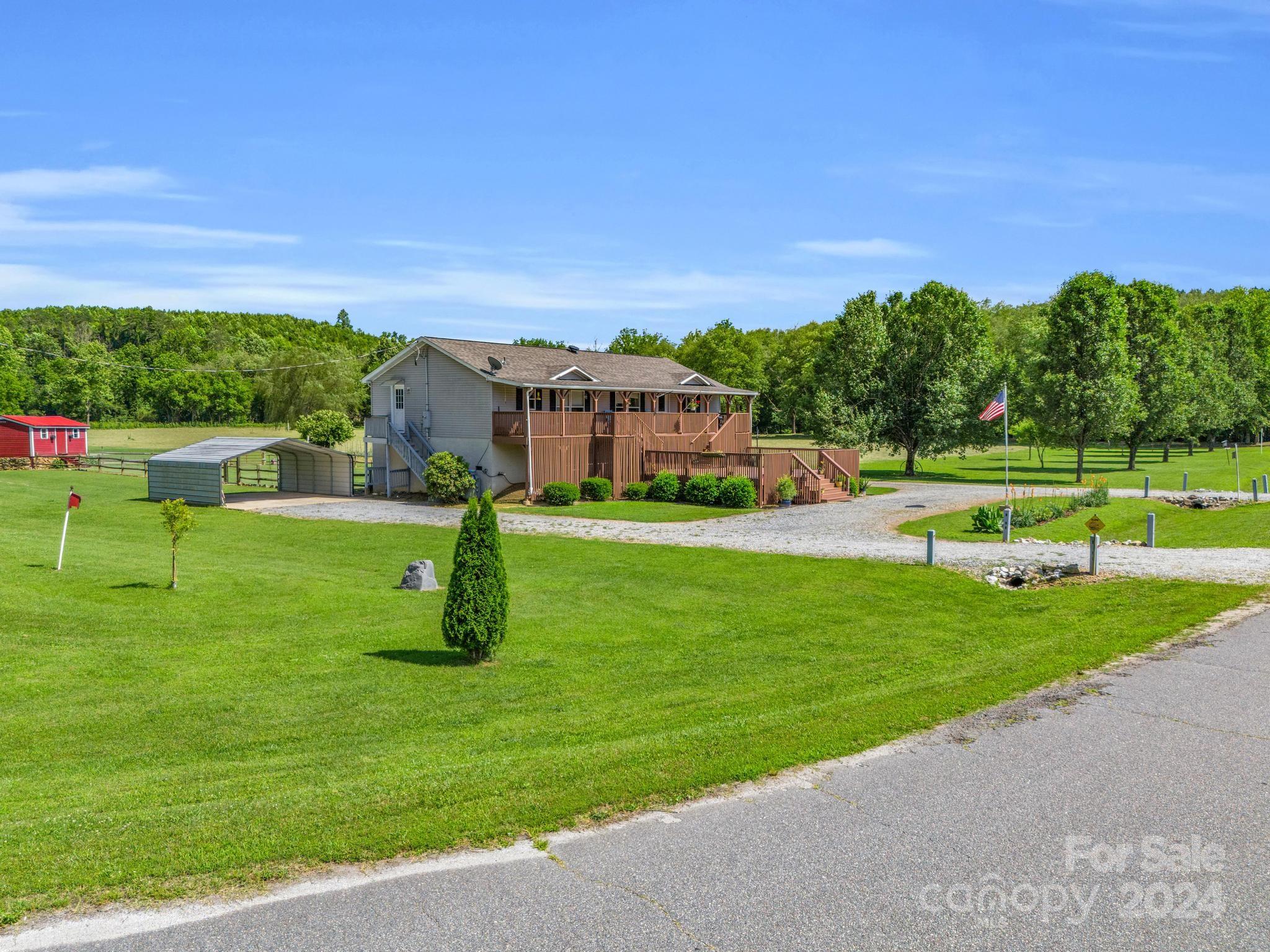 202 Mogene Road Rutherfordton, NC 28139 - Photo 2 of 40 a view of a garden with houses