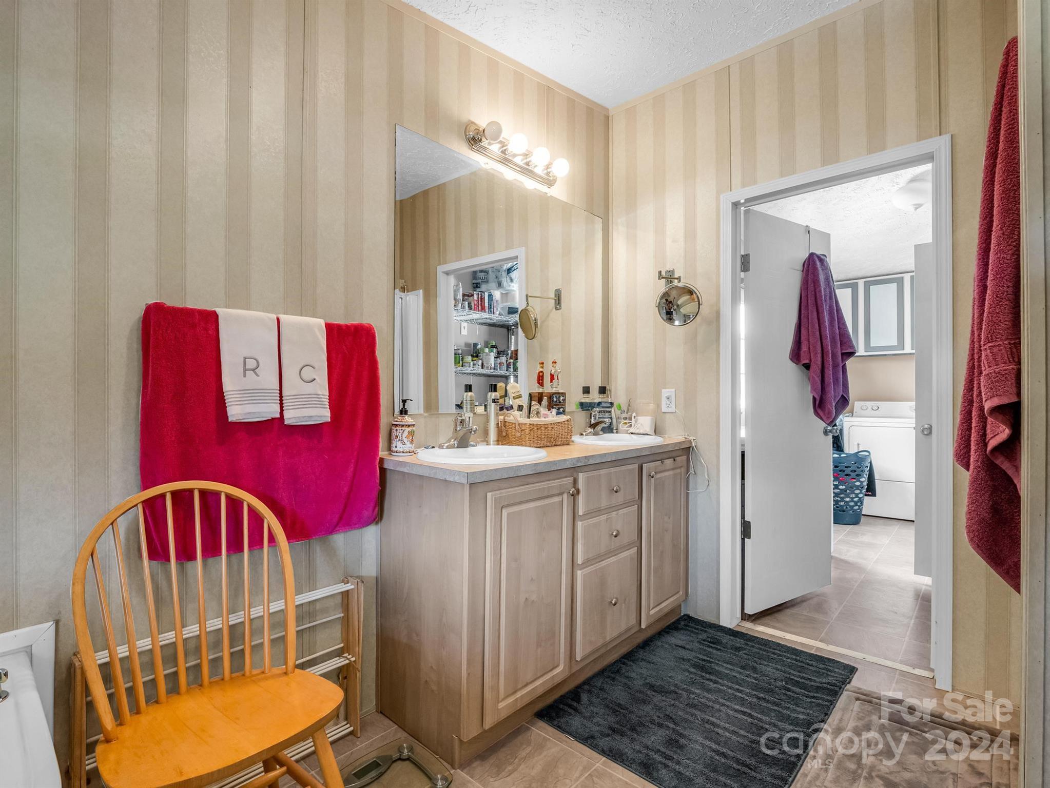 202 Mogene Road Rutherfordton, NC 28139 - Photo 23 of 40 a bathroom with a sink a mirror and a shower