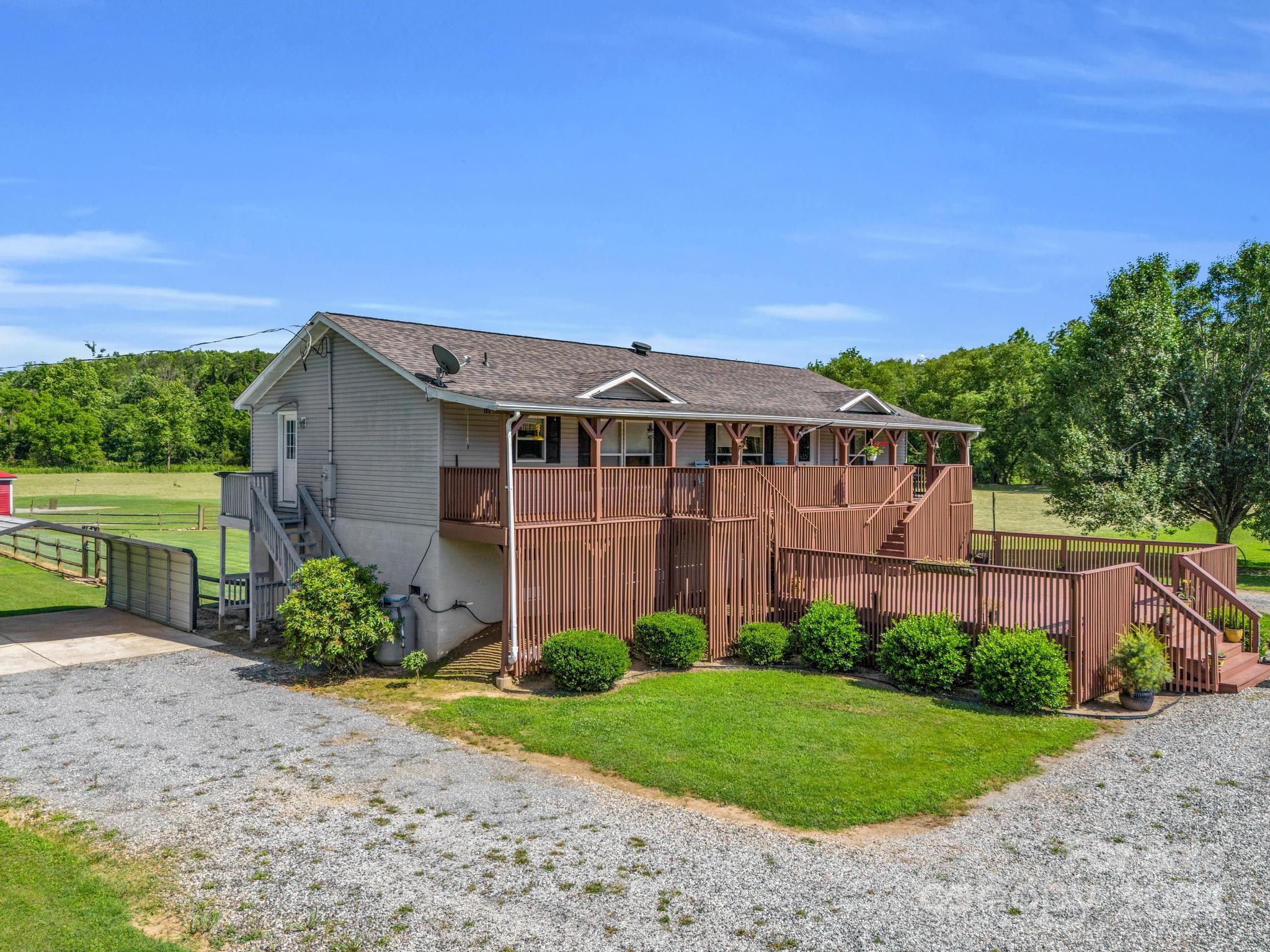 202 Mogene Road Rutherfordton, NC 28139 - Photo 3 of 40 a view of a house with a yard and plants