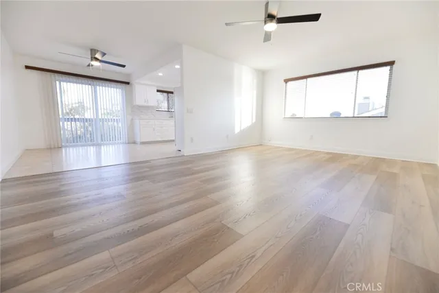 a view of a white house with a large windows