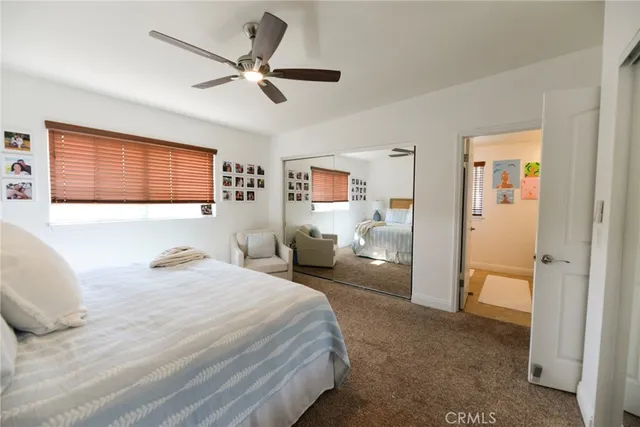 a bedroom with a bed and couch