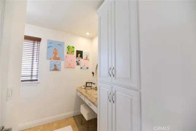 a view of a livingroom with furniture and a flat screen tv
