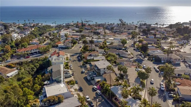 a large white building with a view of swimming pool