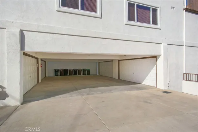 a kitchen with stainless steel appliances white cabinets and a refrigerator