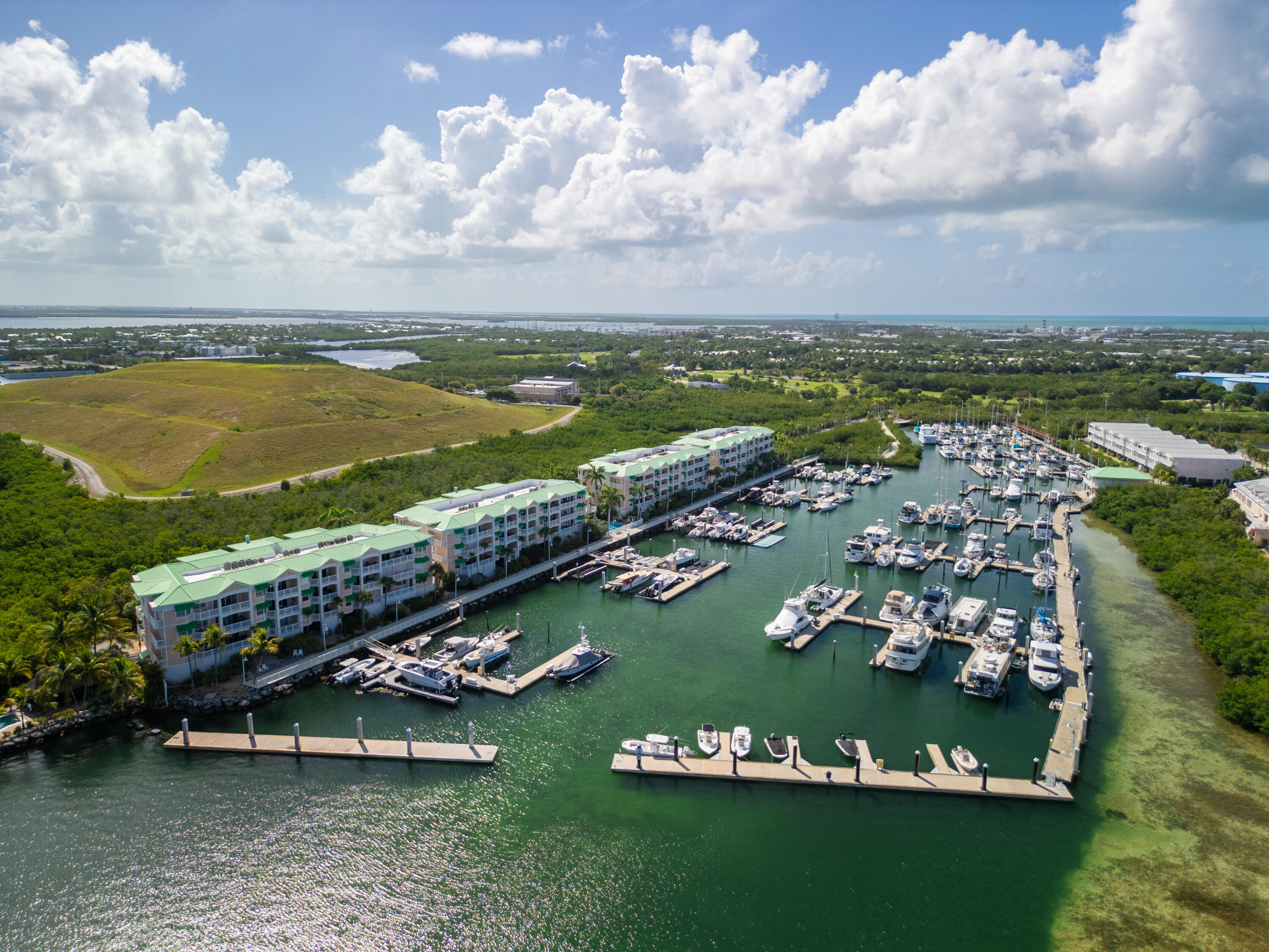 5555 College Road, Unit BARRACUDA #9 Key West, FL 33040 - Photo 13 of 18 an aerial view of a city with lots of residential buildings lake and boat