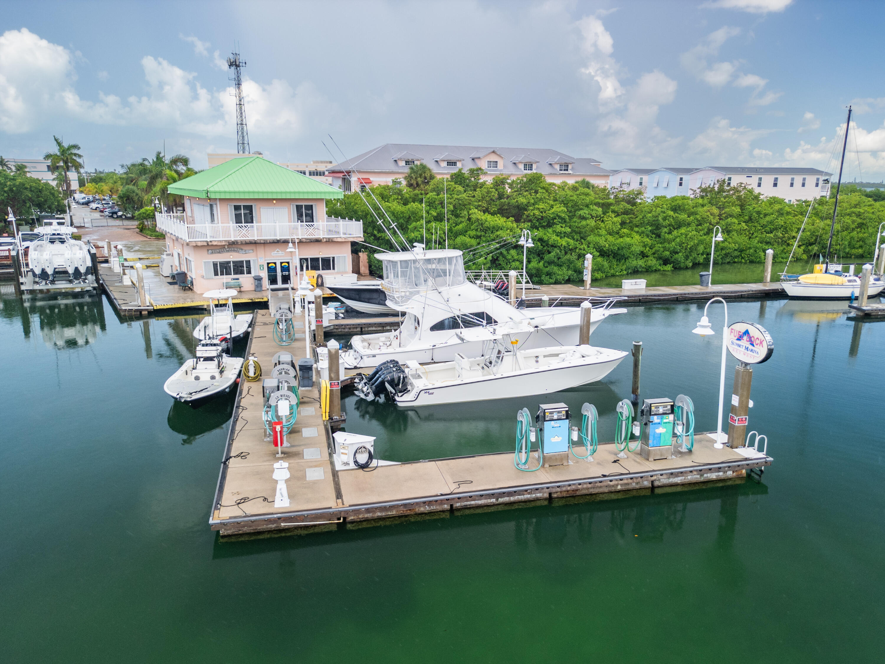 5555 College Road, Unit BARRACUDA #9 Key West, FL 33040 - Photo 16 of 18 a view of a house with pool and chairs