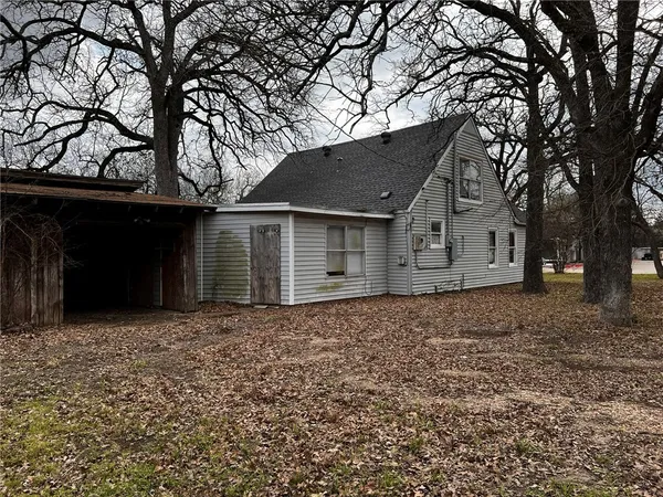 a house with trees in the background
