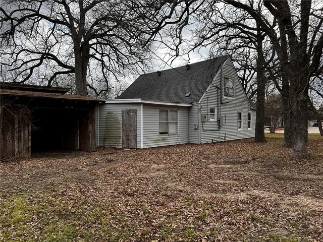 a house with trees in the background