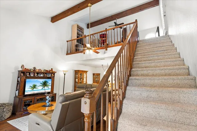 a bedroom with bed and a window