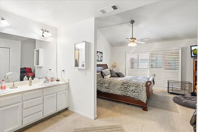 a bedroom with furniture and a window