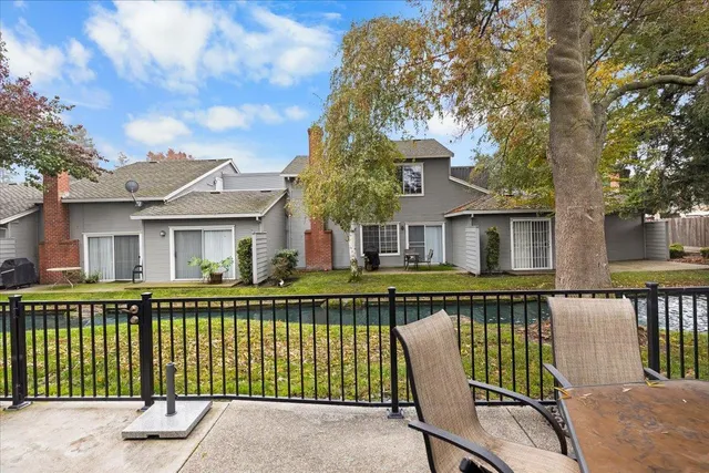 a view of a patio with a table and chairs