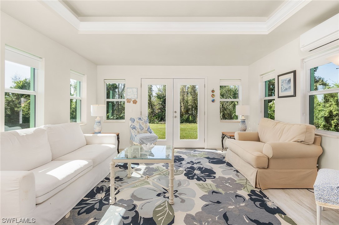 5791 Mackerel Road Bokeelia, FL 33922 - Photo 16 of 24 a living room with furniture and large windows