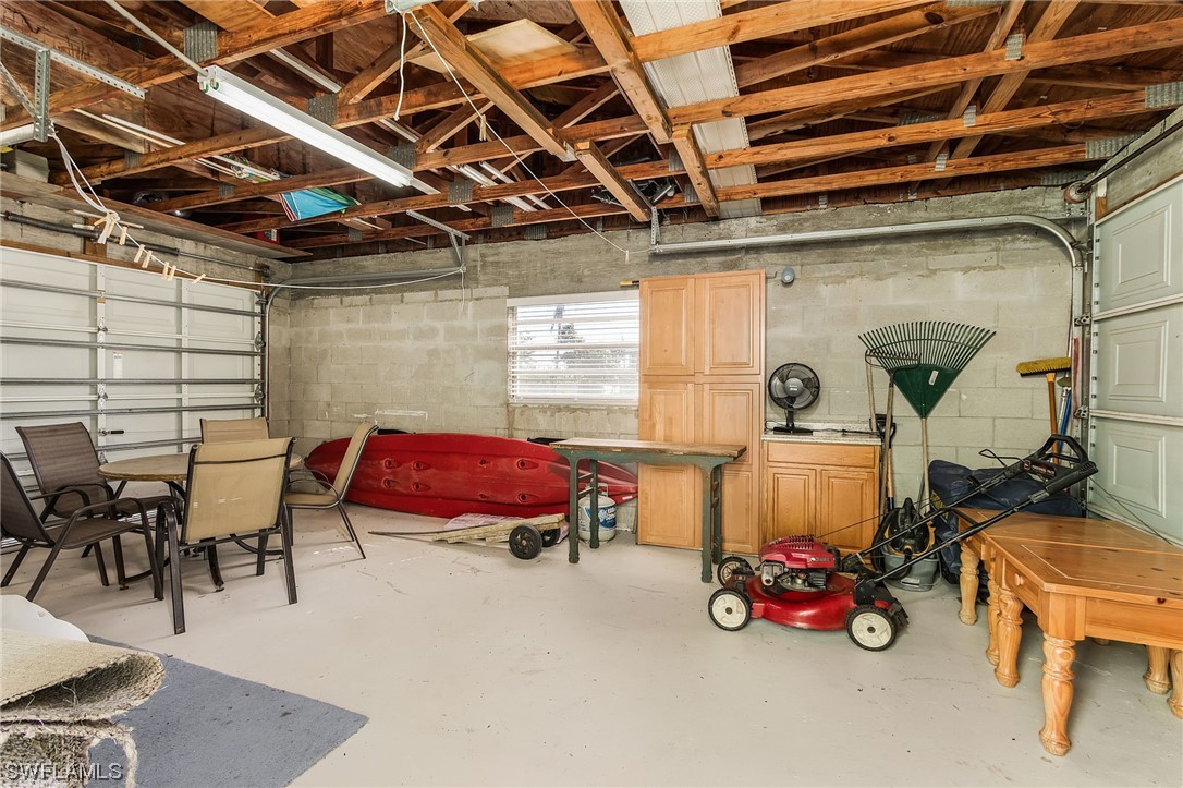 5791 Mackerel Road Bokeelia, FL 33922 - Photo 19 of 24 a bedroom with furniture and a window