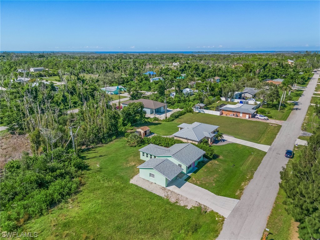 5791 Mackerel Road Bokeelia, FL 33922 - Photo 20 of 24 an aerial view of residential houses with outdoor space and street view