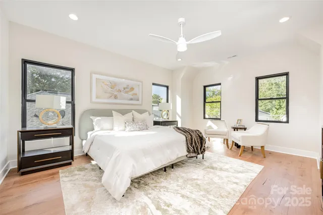 a bedroom with a large bed and a couch