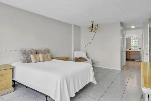a bedroom with a bed and a walk in closet