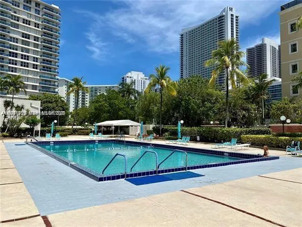 a view of a swimming pool with a lounge chairs