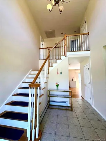 a view of entryway and hall with a window