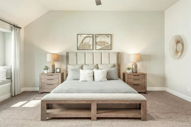 a bed room with a bed and a large window