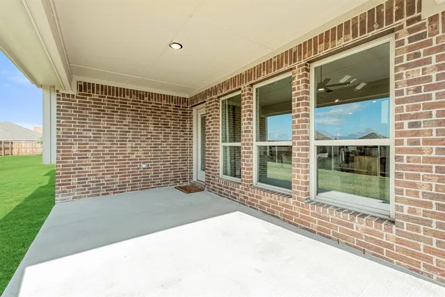 a view of a house with backyard and porch