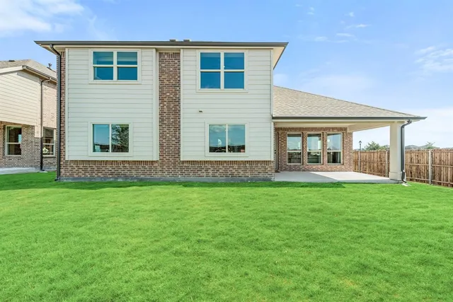 a view of house with backyard porch and garden