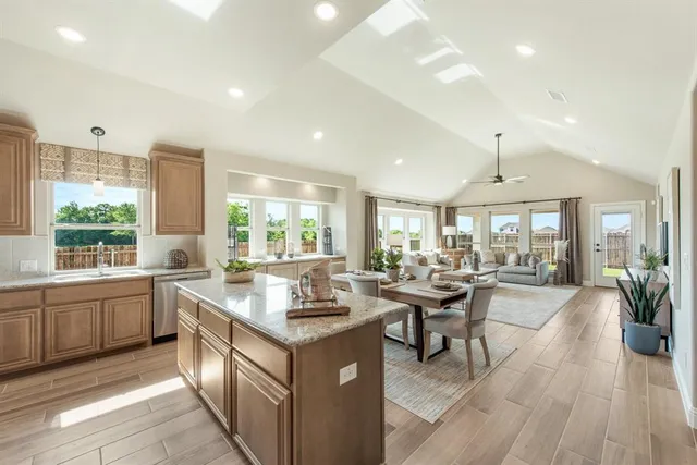 a very nice looking living room with a large window and wooden floor
