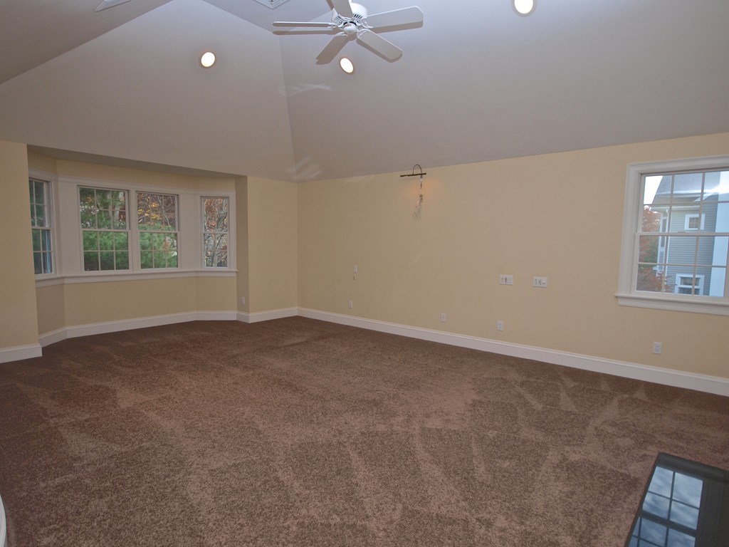 218 Bridle Trail Road Needham, MA 02492 - Photo 13 of 30 a view of a livingroom with a ceiling fan and window