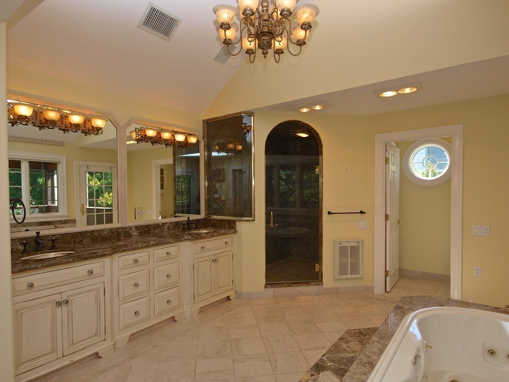 218 Bridle Trail Road Needham, MA 02492 - Photo 16 of 30 a spacious bathroom with a granite countertop sink a mirror and a shower