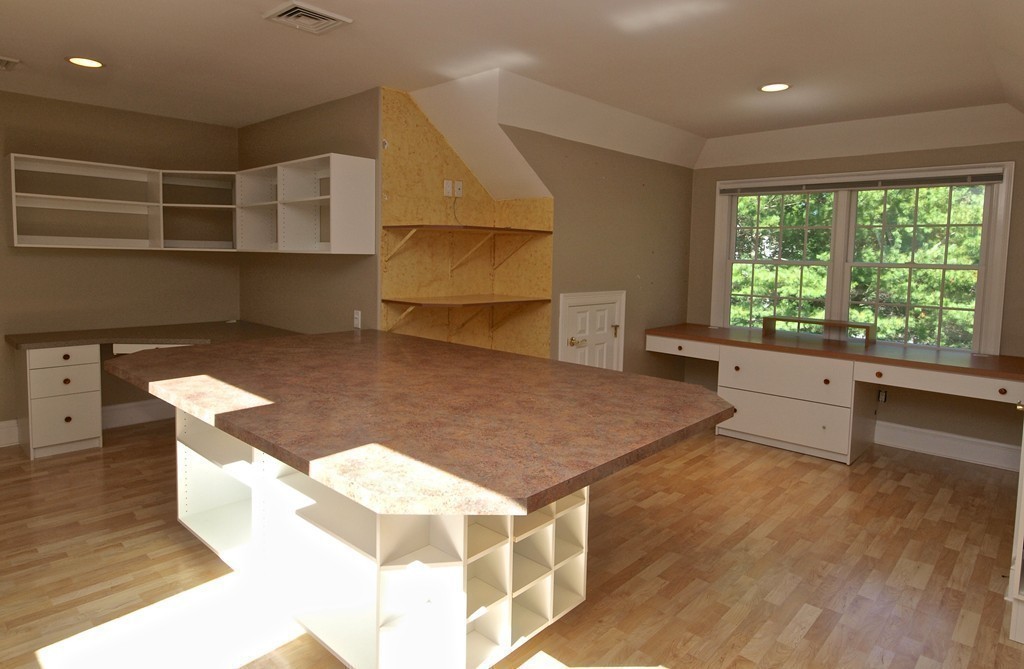 218 Bridle Trail Road Needham, MA 02492 - Photo 23 of 30 a kitchen with stainless steel appliances kitchen island granite countertop a sink and a stove