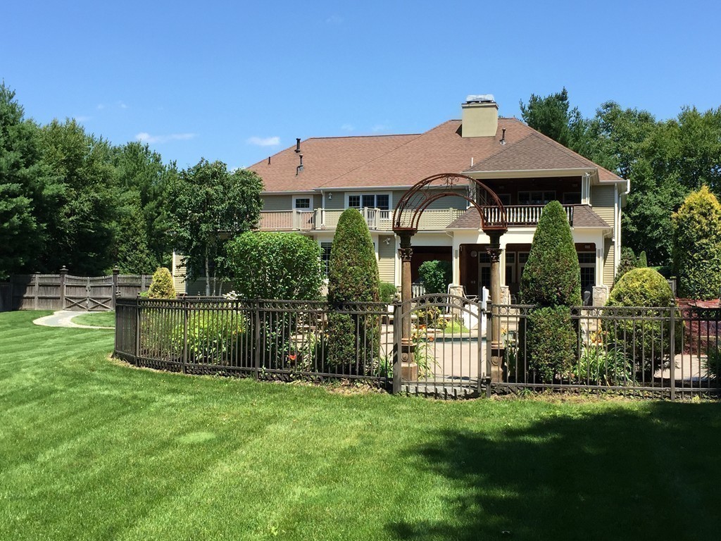218 Bridle Trail Road Needham, MA 02492 - Photo 29 of 30 a front view of a house with a garden