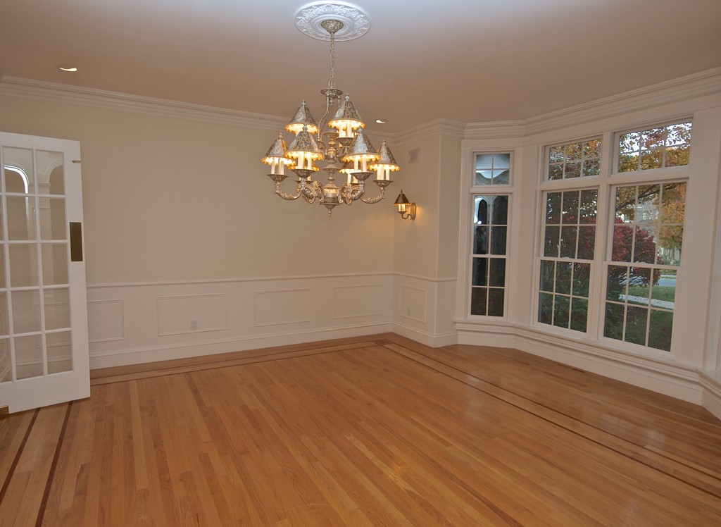 218 Bridle Trail Road Needham, MA 02492 - Photo 7 of 30 a view of a room with wooden floor and large windows