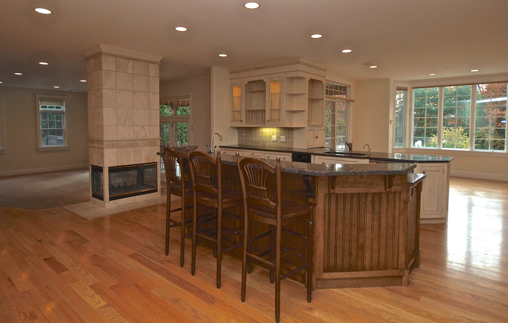 218 Bridle Trail Road Needham, MA 02492 - Photo 8 of 30 a kitchen with stainless steel appliances granite countertop a stove a sink and a microwave