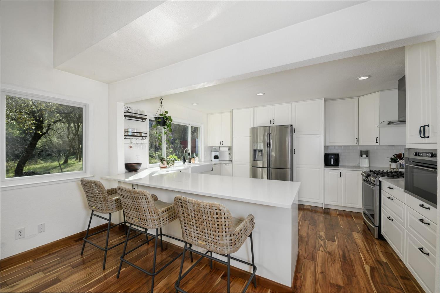 3640 Omo Ranch Road Somerset, CA 95684 - Photo 14 of 57 Gorgeous updated kitchen with quartz counters and stainless appliances