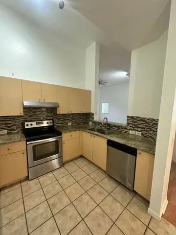 a view of a room with wooden floor and staircase