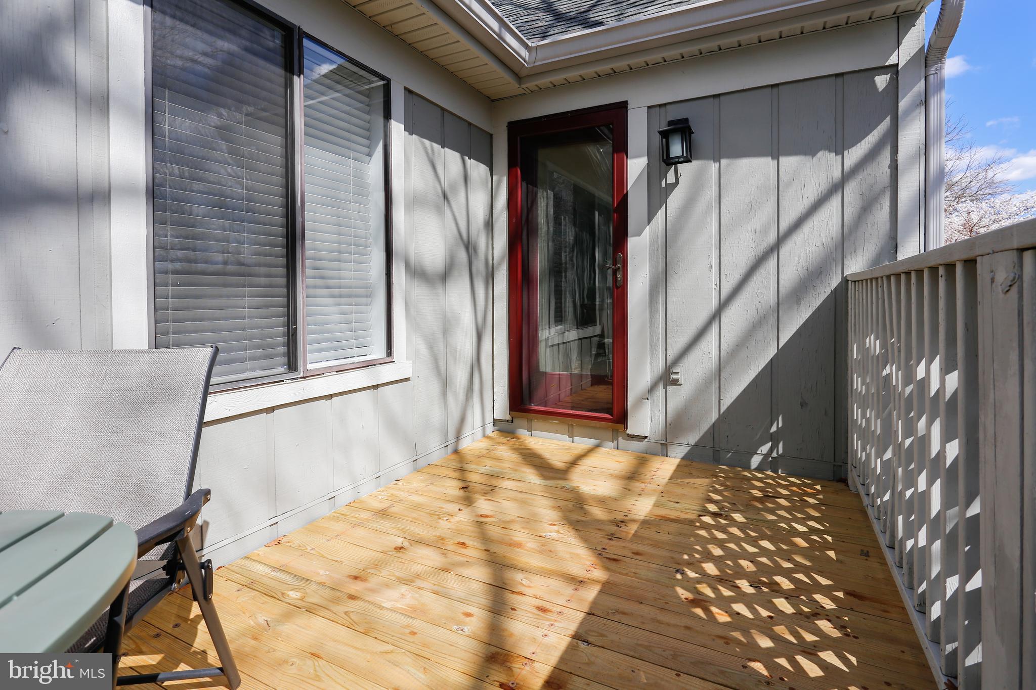 2228 Hunter's Run Drive, Unit 2228 Reston, VA 20191 - Photo 26 of 35 Deck off the Sunroom - more great space