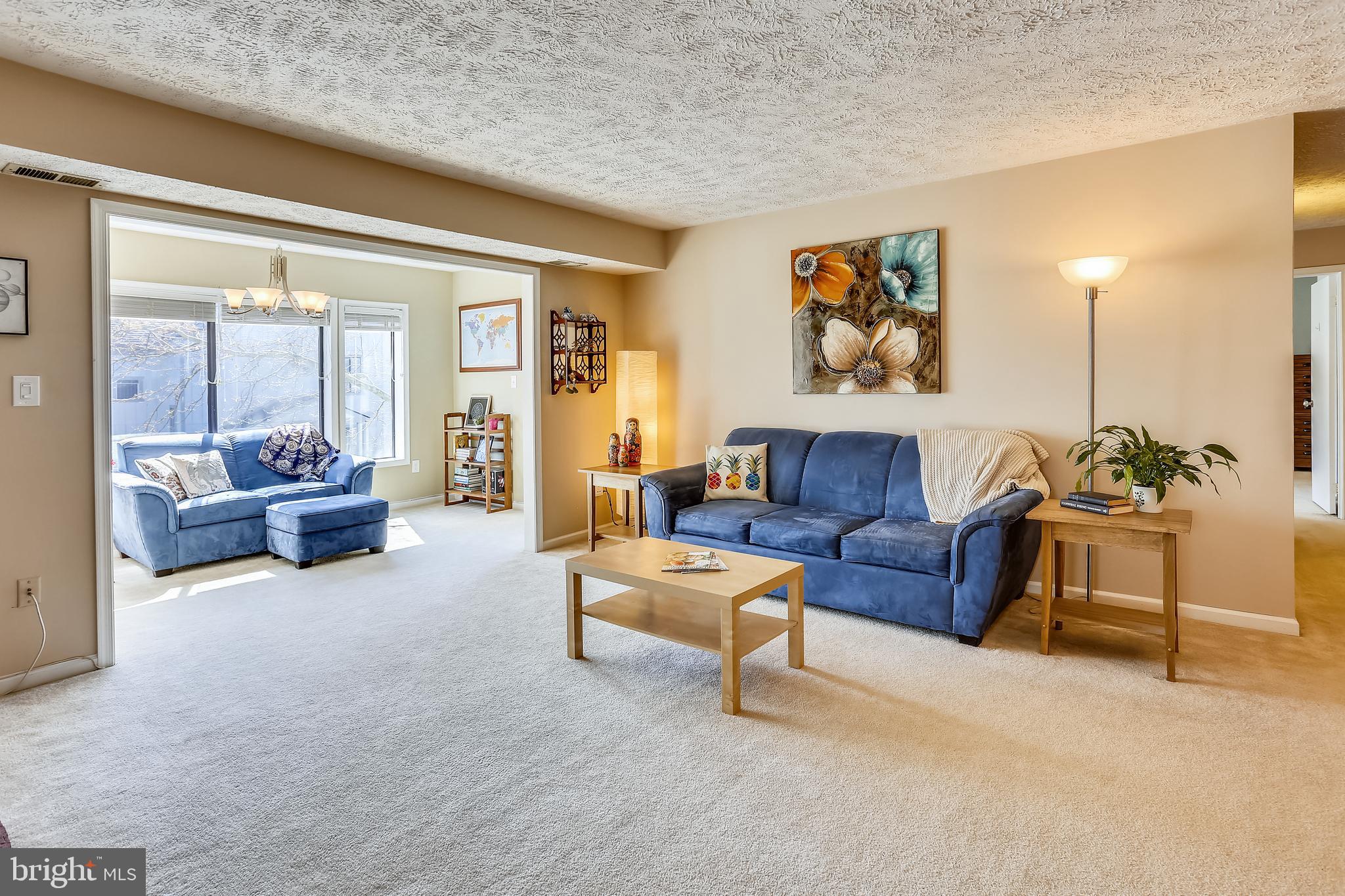 2228 Hunter's Run Drive, Unit 2228 Reston, VA 20191 - Photo 10 of 35 Wonderfully bright and open Living Room w/Sunroom