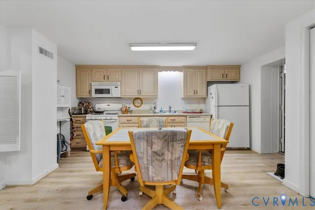a view of a dining room with furniture