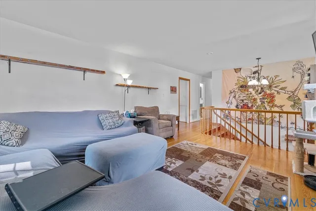 a living room with furniture and a rug