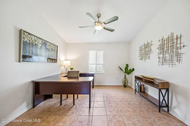 a workspace with furniture and window