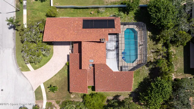 an aerial view of balcony with an outdoor space and seating