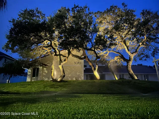 a view of an house with a tree in a park