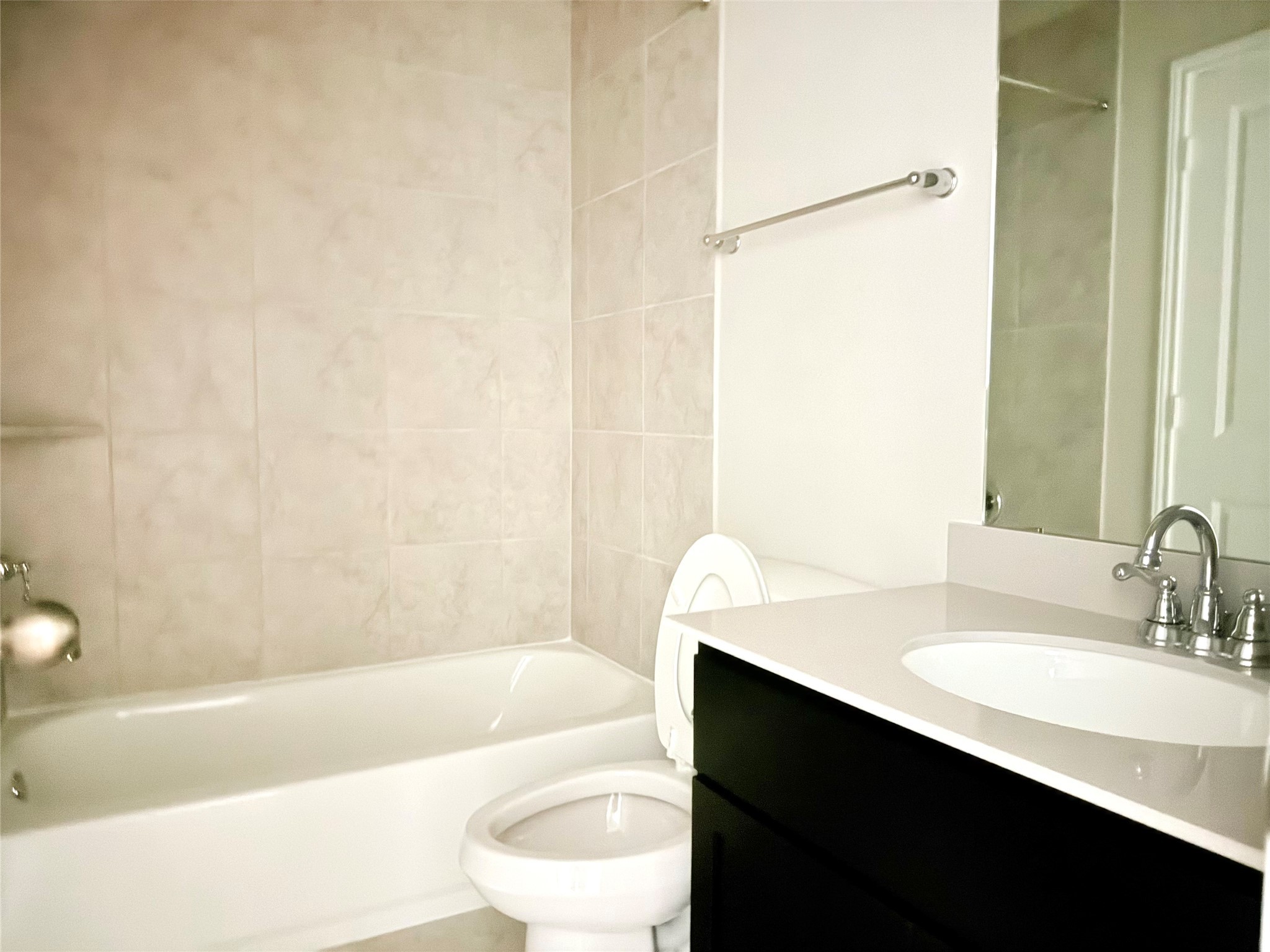 13814 San Pasqual Pointe Drive Cypress, TX 77433 - Photo 20 of 24 a bathroom with a sink a toilet and bathtub