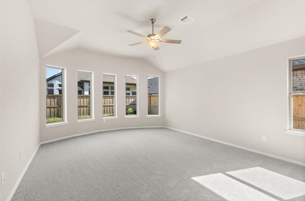 13814 San Pasqual Pointe Drive Cypress, TX 77433 - Photo 10 of 24 an empty room with windows and ceiling fan