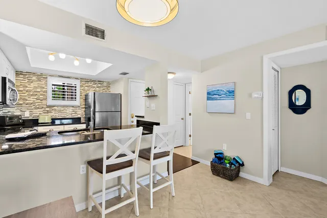 a view of living room with furniture and wooden floor