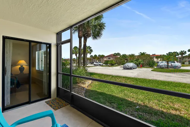 a view of a house with a yard patio and slide